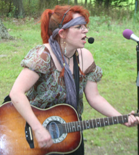 photo: Elizabeth playing her Ovation guitar